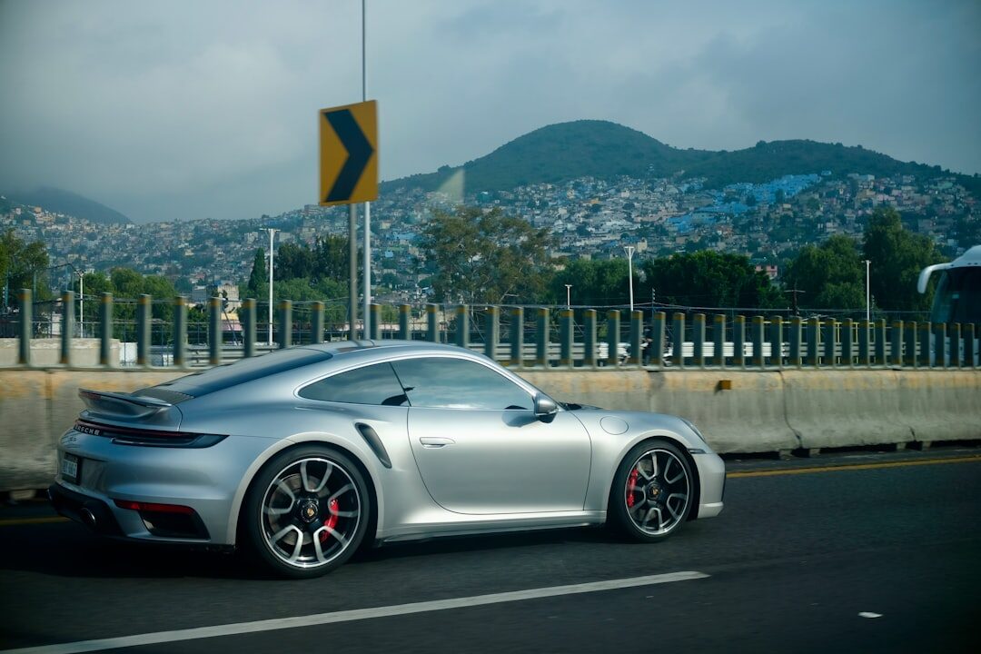 luxury sports car driving on highway