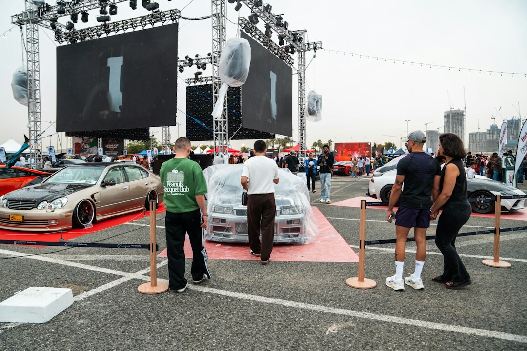 Classic automobile displayed on a stage during an auction event