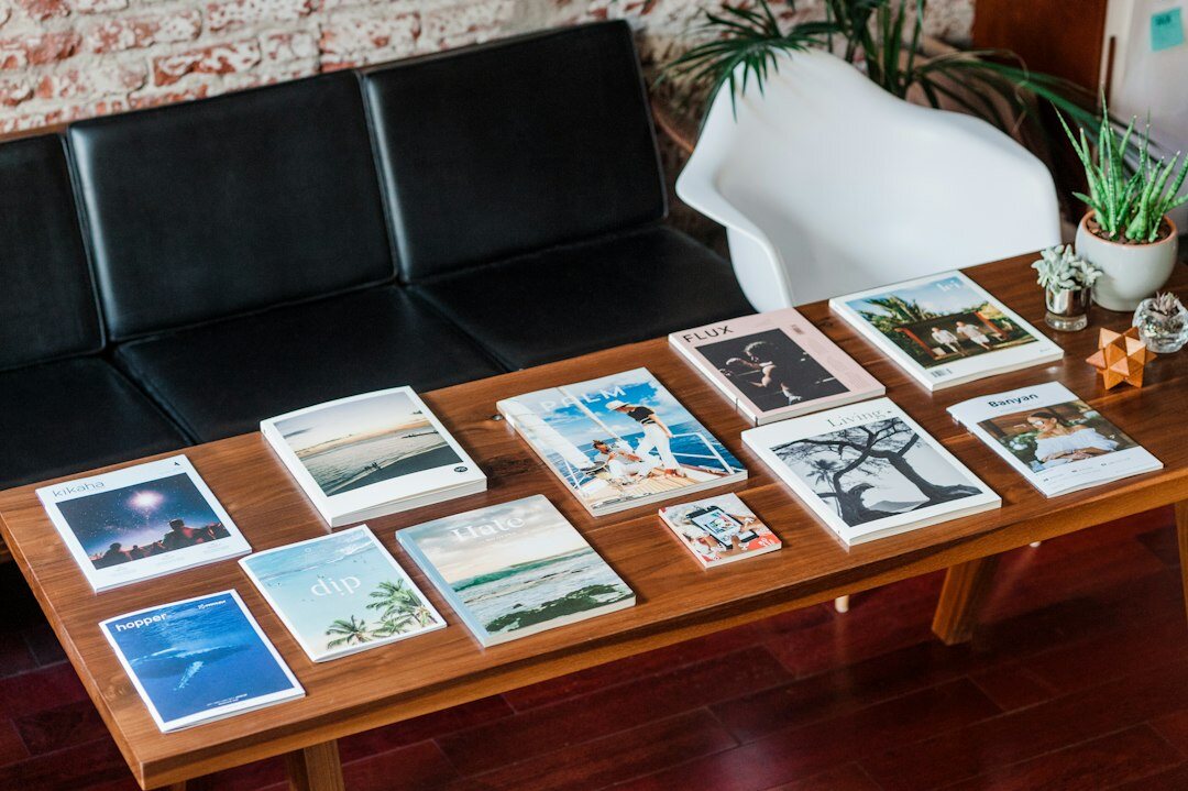 Editorial office desk with vintage automobile photographs and archives