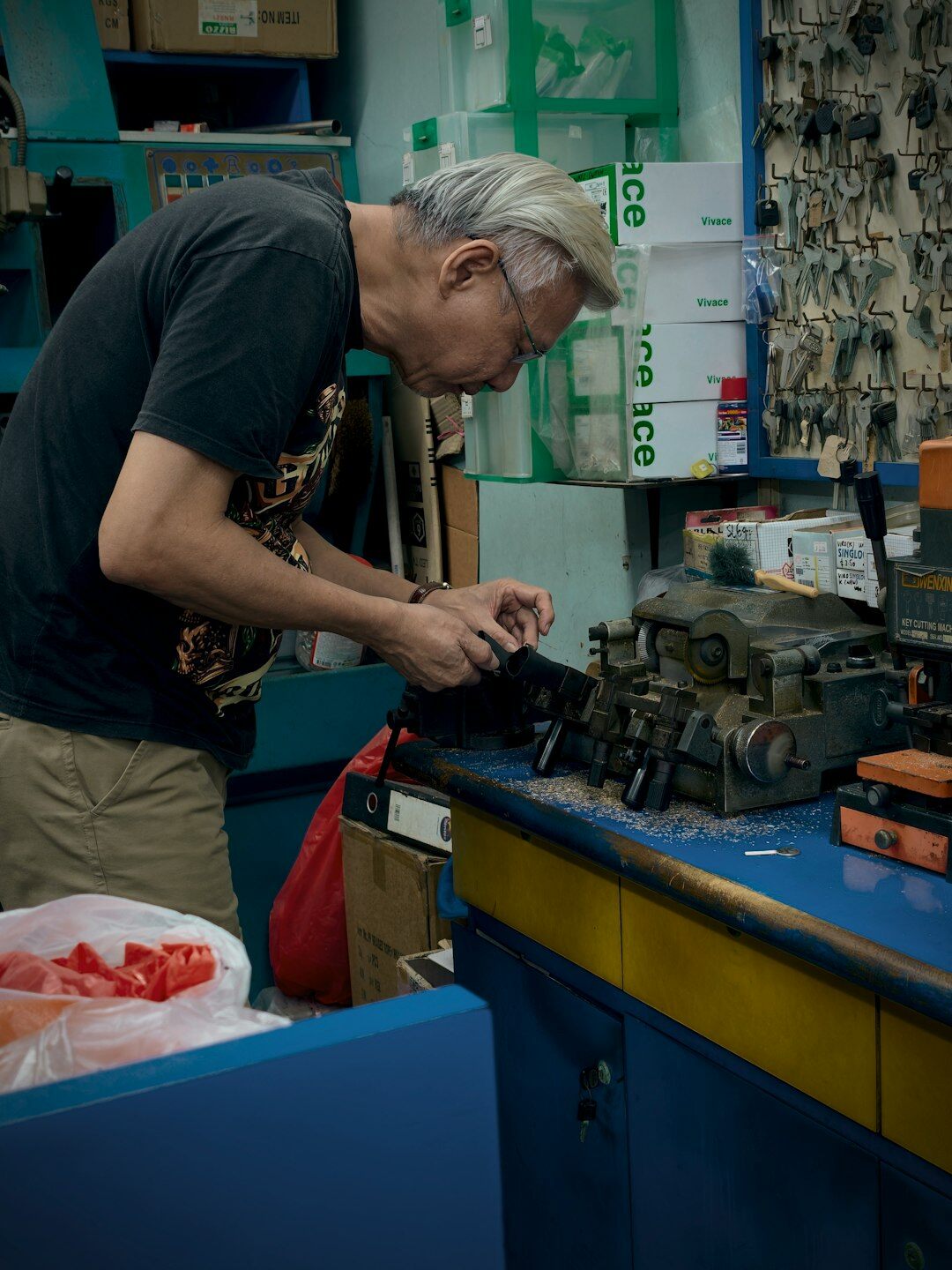 Mechanic restoring a vintage automobile engine in a workshop